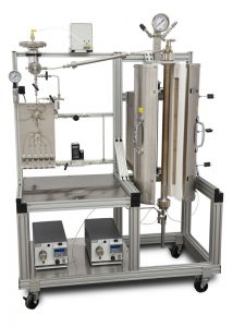 Up-flow 5403 Tubular Reactor System with 300 mL heated volume, one purge line, one gas feed, two liquid feeds, product cooling condenser, and automated 2-phase back pressure regulator. An automated liquid sampler captures representative samples at a user-programmable interval.